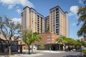  Located at 110 S. Laredo St. in downtown San Antonio, The Continental Residences is a 16-story residential building placed between the historic Continental Hotel, Arana Building and De La Garza House on the 1.9-acre Continental Block along San Pedro Creek. (Photo courtesy of BKV Group.)